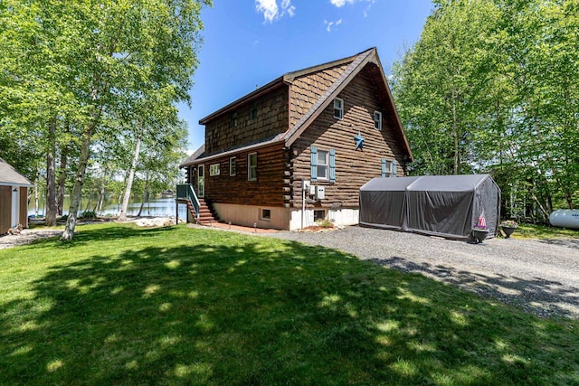 72 Auclair Rd, Middleton, NH 03887 - back of house with log exterior, a water view, and a yard