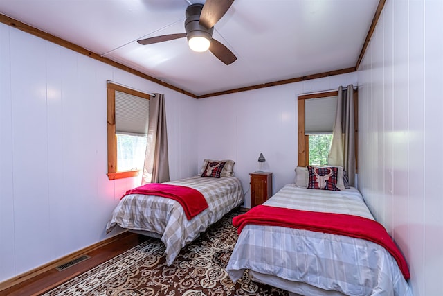 72 Auclair Rd, Middleton, NH 03887 - bedroom featuring crown molding, wood finished floors, and ceiling fan