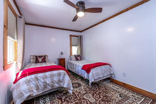 72 Auclair Rd, Middleton, NH 03887 - bedroom featuring multiple windows, a ceiling fan, wood finished floors, and ornamental molding