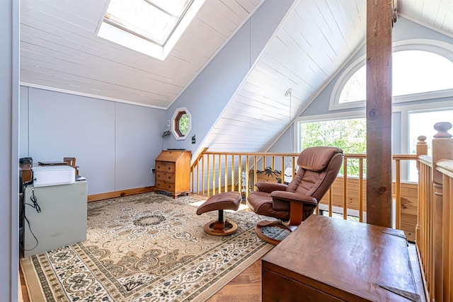 72 Auclair Rd, Middleton, NH 03887 - living area with a skylight, lofted ceiling, and wood finished floors