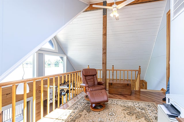 72 Auclair Rd, Middleton, NH 03887 - living area featuring lofted ceiling, a ceiling fan, wood finished floors, an upstairs landing, and a water view