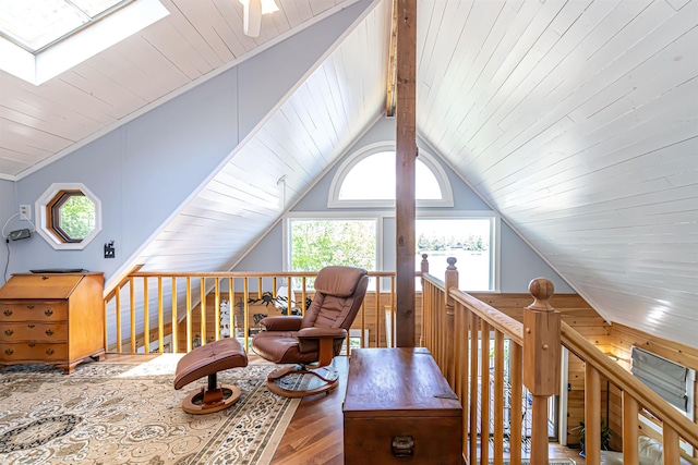 72 Auclair Rd, Middleton, NH 03887 - sitting room featuring wood finished floors, a skylight, lofted ceiling, an upstairs landing, and wood ceiling