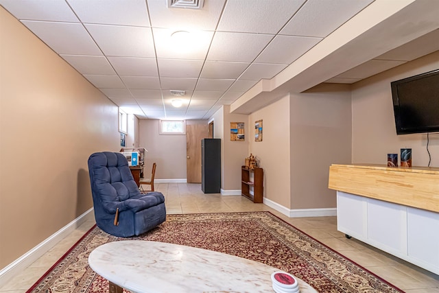 72 Auclair Rd, Middleton, NH 03887 - sitting room with a paneled ceiling, light tile patterned floors, and baseboards