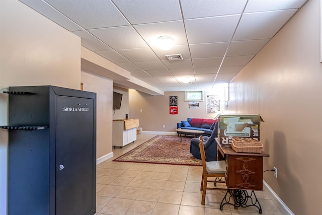 72 Auclair Rd, Middleton, NH 03887 - dining room featuring light tile patterned flooring, a drop ceiling, and baseboards