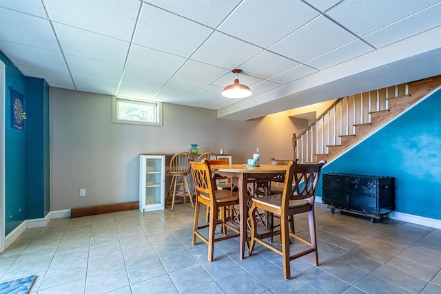 72 Auclair Rd, Middleton, NH 03887 - tiled dining room with a paneled ceiling, baseboards, and stairway