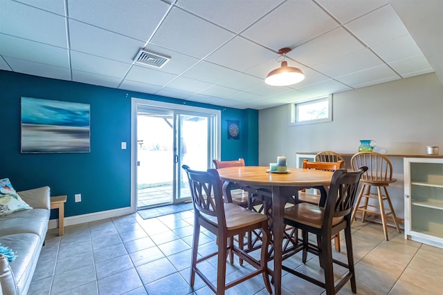 72 Auclair Rd, Middleton, NH 03887 - dining area with a drop ceiling, baseboards, and light tile patterned floors