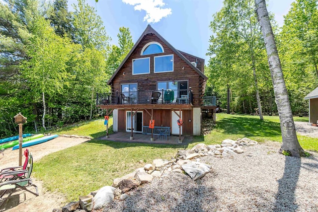 72 Auclair Rd, Middleton, NH 03887 - rear view of property with log exterior, a wooden deck, a lawn, and a patio area