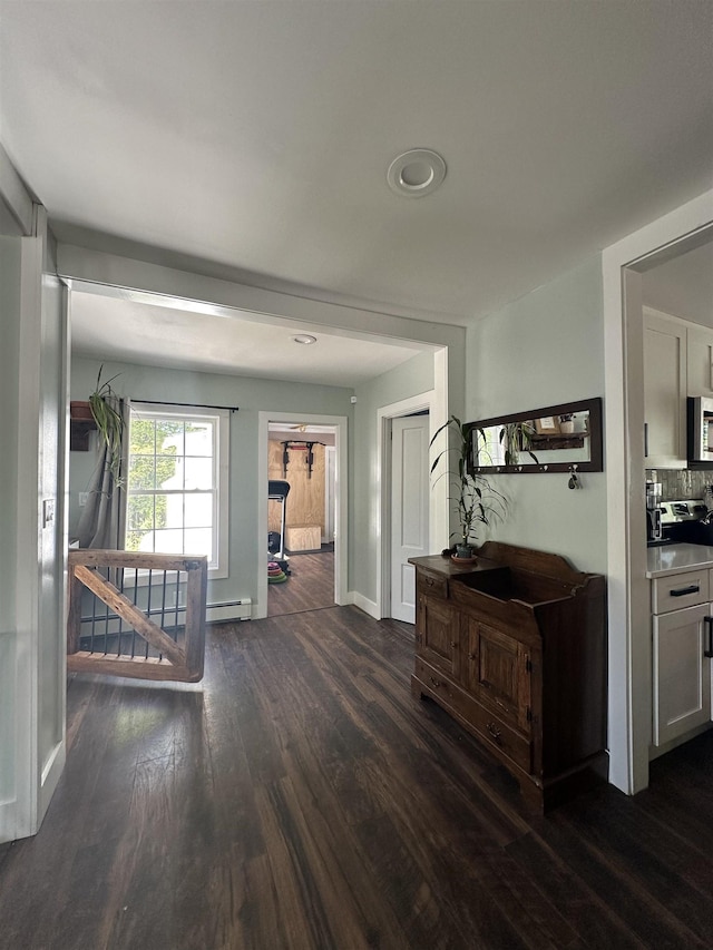 8 Main St, Bennington, NH 03442 - corridor featuring dark wood finished floors, baseboards, and recessed lighting