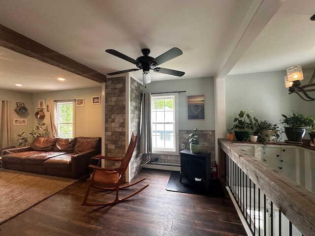 8 Main St, Bennington, NH 03442 - living room featuring dark wood-type flooring, a wood stove, baseboard heating, ceiling fan, and recessed lighting