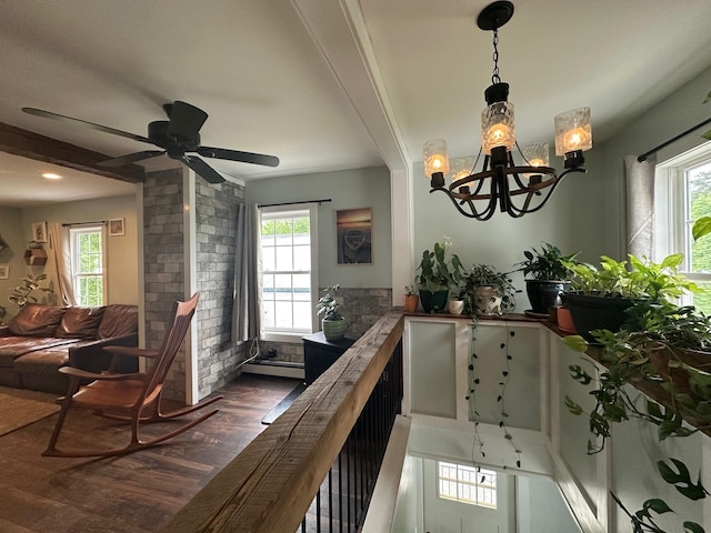8 Main St, Bennington, NH 03442 - dining room with baseboard heating, dark wood-style floors, a chandelier, and ceiling fan