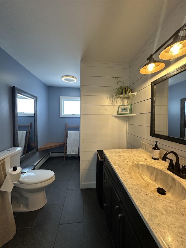 8 Main St, Bennington, NH 03442 - bathroom featuring toilet, vanity, baseboard heating, and tile patterned flooring