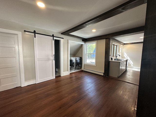8 Main St, Bennington, NH 03442 - unfurnished bedroom featuring a baseboard radiator, separate washer and dryer, a barn door, dark wood finished floors, and baseboards