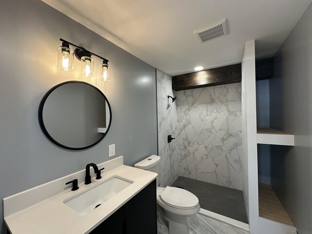 8 Main St, Bennington, NH 03442 - bathroom with marble look tiles, vanity, toilet, and a marble finish shower