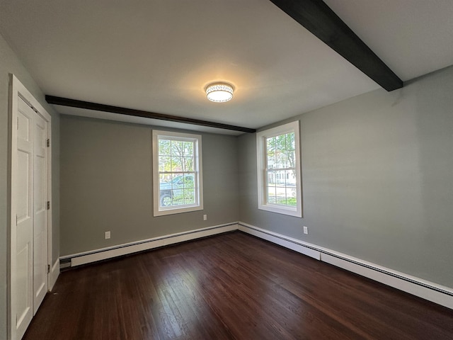 8 Main St, Bennington, NH 03442 - unfurnished bedroom with dark wood finished floors, baseboard heating, and baseboards