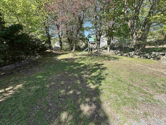 8 Main St, Bennington, NH 03442 - view of green lawn featuring a playground
