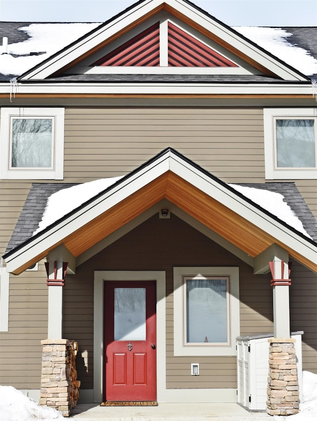 369 Bear Path Ln Unit 30, Burke, VT 05832 - snow covered property entrance with a shingled roof and a porch