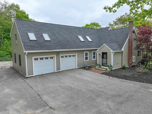 278 N Rd, Deerfield, NH 03037 - view of front facade with a shingled roof, driveway, a garage, and a chimney