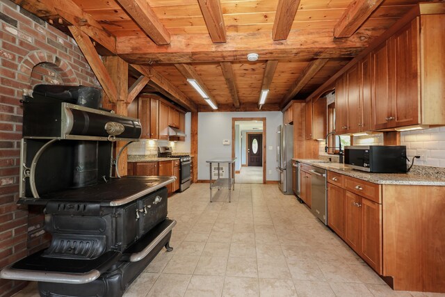 278 N Rd, Deerfield, NH 03037 - kitchen with stainless steel appliances, wood ceiling with exposed beams, brown cabinetry, tasteful backsplash, and light stone countertops
