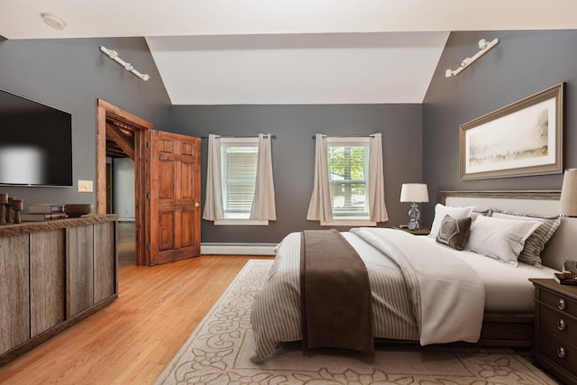 278 N Rd, Deerfield, NH 03037 - bedroom with vaulted ceiling, baseboard heating, and light wood-type flooring