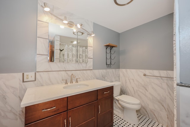 278 N Rd, Deerfield, NH 03037 - bathroom featuring tile walls, vanity, tile patterned floors, toilet, and wainscoting