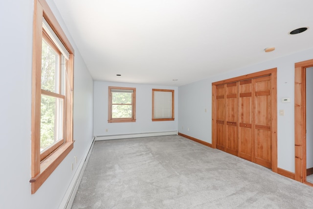278 N Rd, Deerfield, NH 03037 - unfurnished bedroom with carpet floors, a baseboard radiator, baseboards, and a closet