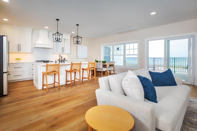465 Ocean Blvd Unit 201, Hampton, NH 03842 - living area with light wood finished floors and recessed lighting