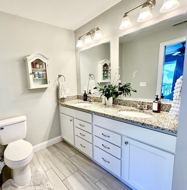 17 Callaway Dr Unit 4, Concord, NH 03301 - bathroom with double vanity, toilet, and baseboards