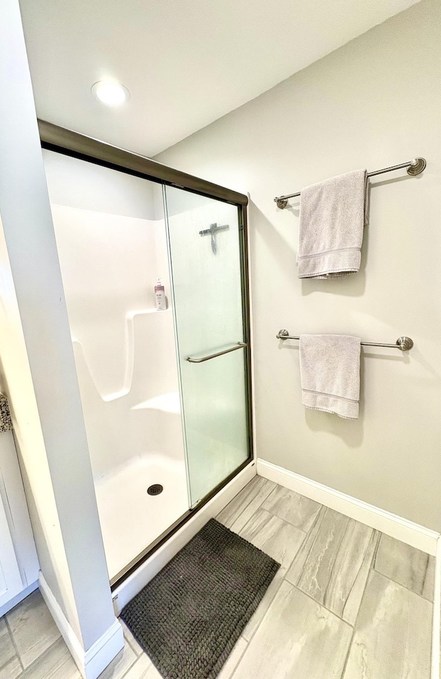 17 Callaway Dr Unit 4, Concord, NH 03301 - bathroom with baseboards, a stall shower, and marble finish flooring