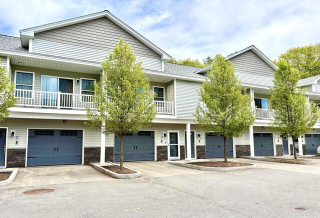 17 Callaway Dr Unit 4, Concord, NH 03301 - townhome / multi-family property with an attached garage, stone siding, and driveway