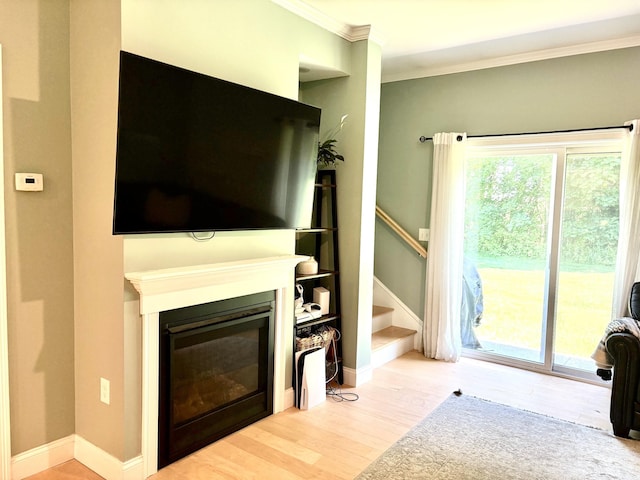 17 Callaway Dr Unit 4, Concord, NH 03301 - living area with ornamental molding, wood finished floors, a glass covered fireplace, baseboards, and stairway