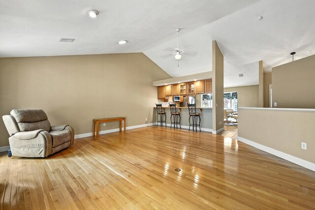 27 Autumn Ln, Hampstead, NH 03826 - living room with light wood-style floors, ceiling fan, vaulted ceiling, and baseboards