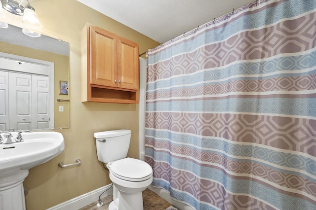 27 Autumn Ln, Hampstead, NH 03826 - bathroom with baseboards, toilet, a sink, and a shower with curtain