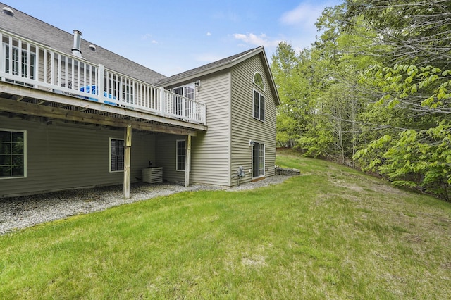 27 Autumn Ln, Hampstead, NH 03826 - rear view of property featuring a wooden deck, a yard, central AC unit, and a shingled roof