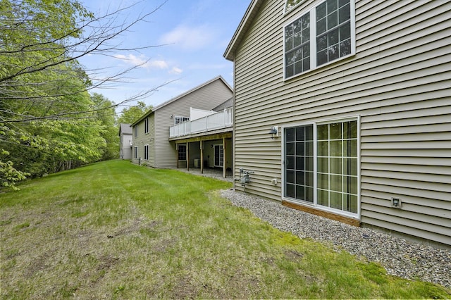 27 Autumn Ln, Hampstead, NH 03826 - view of green lawn with a deck