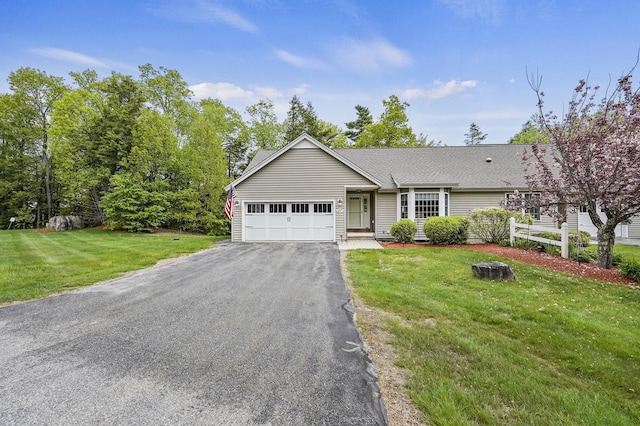 27 Autumn Ln, Hampstead, NH 03826 - ranch-style home with an attached garage, asphalt driveway, a front lawn, and roof with shingles