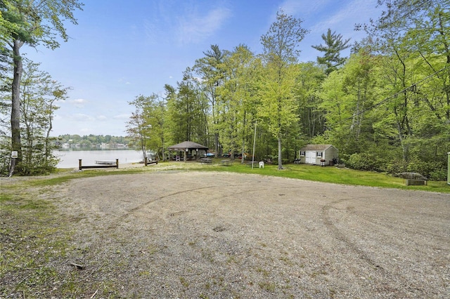 27 Autumn Ln, Hampstead, NH 03826 - view of grassy yard featuring a water view, a dock, and a wooded view