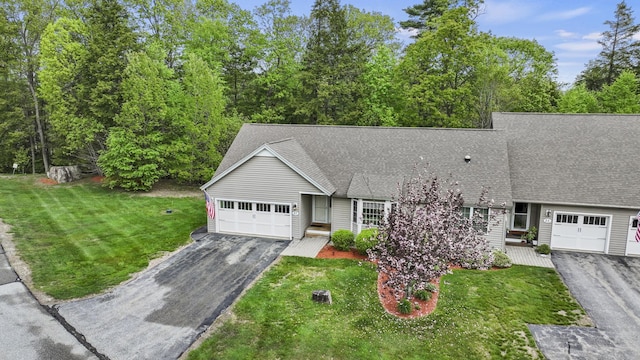 27 Autumn Ln, Hampstead, NH 03826 - view of front of home with asphalt driveway, a garage, a shingled roof, and a front lawn