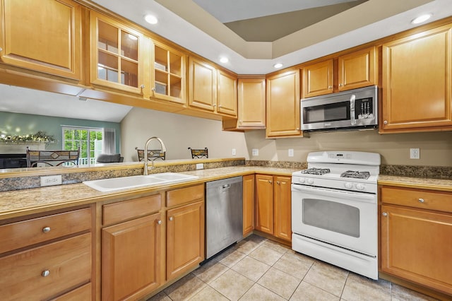 27 Autumn Ln, Hampstead, NH 03826 - kitchen featuring stainless steel appliances, a sink, light tile patterned flooring, glass insert cabinets, and recessed lighting