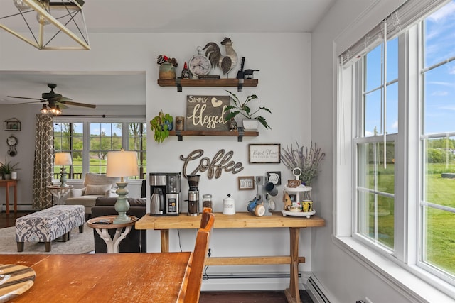 6 Pheasant Run Rd, Fairfax, VT 05454 - dining room with wood finished floors, a ceiling fan, and a baseboard heating unit