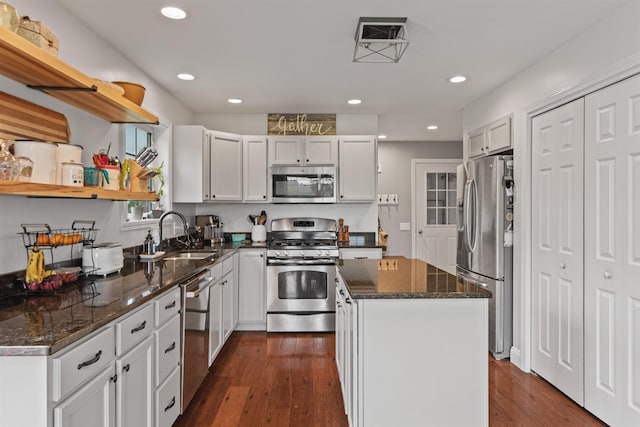 6 Pheasant Run Rd, Fairfax, VT 05454 - kitchen with stainless steel appliances, a sink, open shelves, a kitchen island, and dark stone countertops