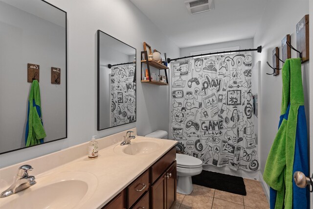6 Pheasant Run Rd, Fairfax, VT 05454 - bathroom featuring toilet, double vanity, and tile patterned floors