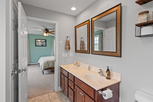 6 Pheasant Run Rd, Fairfax, VT 05454 - ensuite bathroom featuring double vanity, tile patterned floors, toilet, a ceiling fan, and a baseboard heating unit