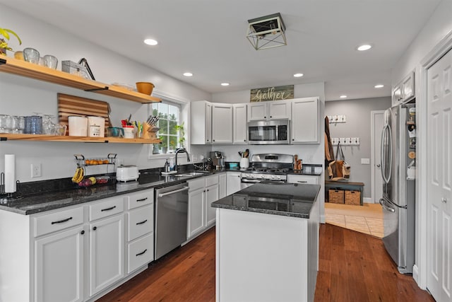 6 Pheasant Run Rd, Fairfax, VT 05454 - kitchen featuring appliances with stainless steel finishes, a sink, a center island, dark stone counters, and dark wood-style floors