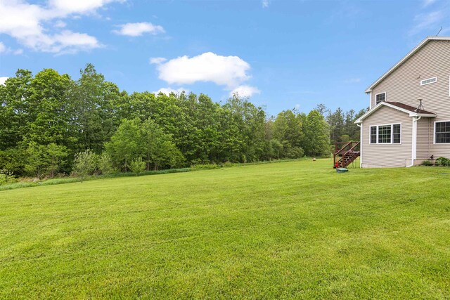 6 Pheasant Run Rd, Fairfax, VT 05454 - view of grassy yard featuring stairs and a deck