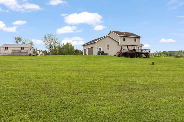 6 Pheasant Run Rd, Fairfax, VT 05454 - view of green lawn featuring a wooden deck, a garage, and stairs