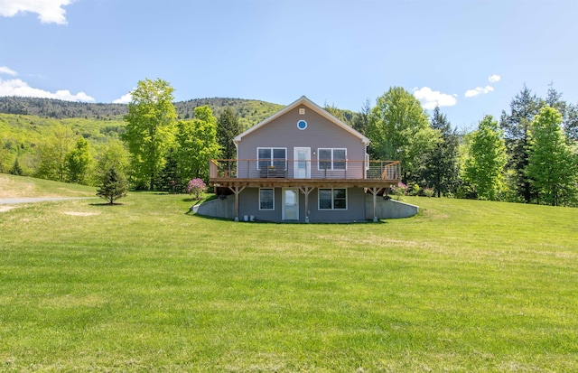 76 Back Of The Moon Rd, Kirby, VT 05832 - back of property featuring a deck, a yard, and a forest view