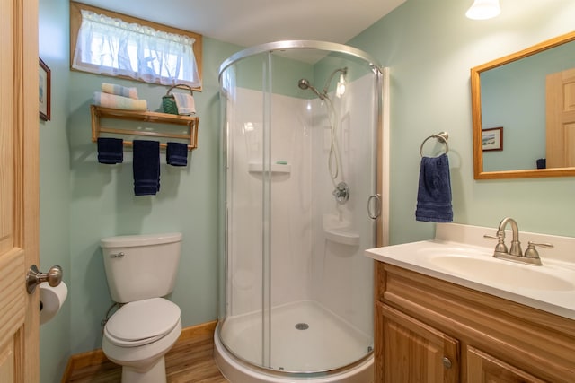76 Back Of The Moon Rd, Kirby, VT 05832 - full bath featuring a stall shower, toilet, vanity, and wood finished floors