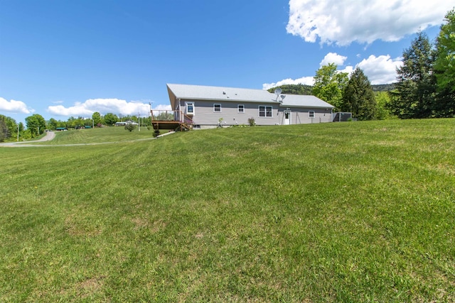 76 Back Of The Moon Rd, Kirby, VT 05832 - rear view of property featuring a deck and a yard