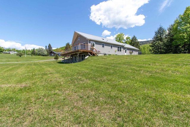 76 Back Of The Moon Rd, Kirby, VT 05832 - rear view of house with a deck and a lawn