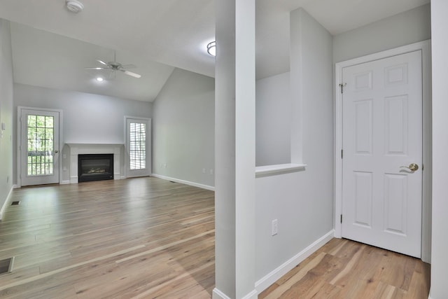 1465 Hooksett Rd Unit 403, Hooksett, NH 03106 - unfurnished living room featuring lofted ceiling, wood finished floors, plenty of natural light, ceiling fan, and baseboards